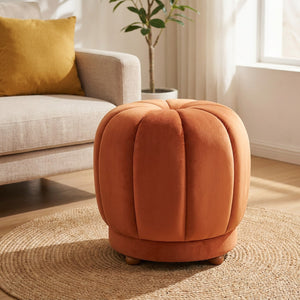 Pouf tabouret citrouille orange terracotta sans roulettes dans un salon lumineux