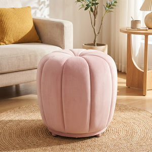 Pouf tabouret citrouille rose pastel sans roulettes dans un salon lumineux