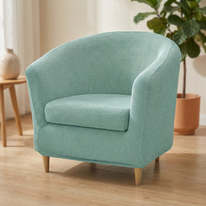 Housse de fauteuil club en jacquard vert d'eau sur un fauteuil arrondi